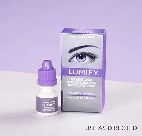 Pair of hands holding up a box of Lumify redness reliever eye drops